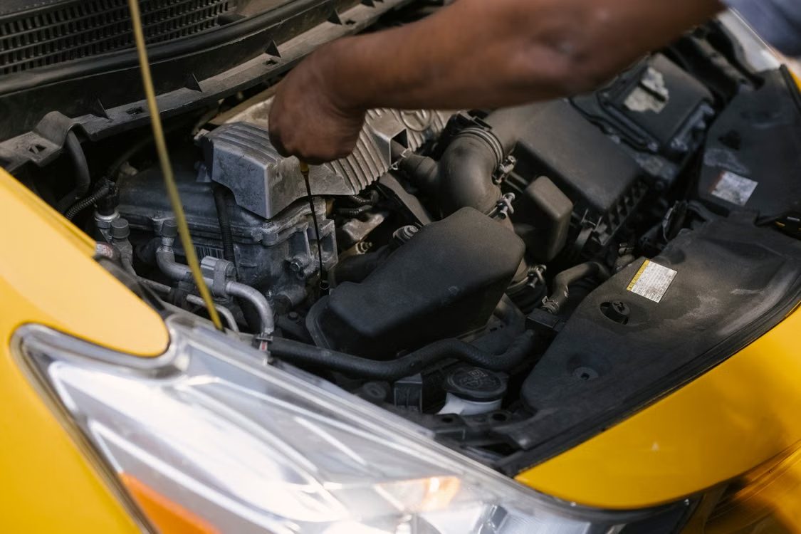 Mechanic working on a car engine