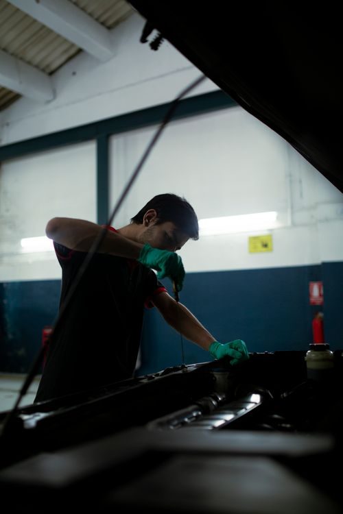Mechanic at work under the hood